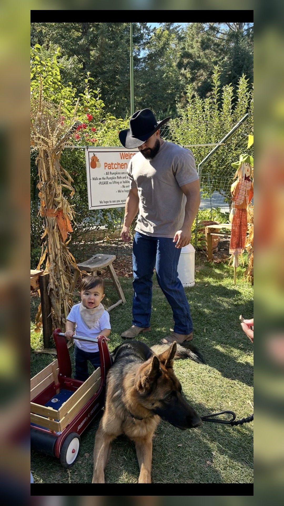 Daniel at the pumpkin patch with family and dog